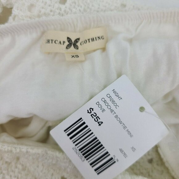 New Nightcap Clothing Crochet Bowtie Mini Dress Womens XS Dove White Cutouts - Picture 5 of 6